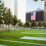 Looking across the grass lawn toward 1 WTC.  